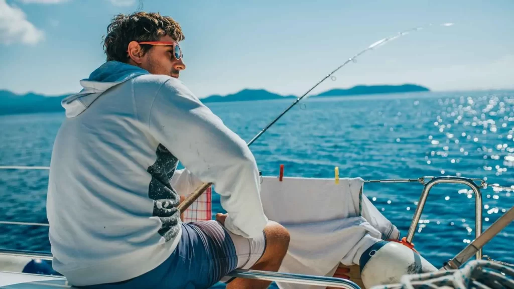 a man fishing on a boat