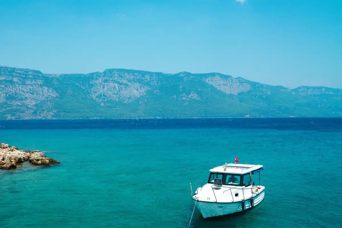 A boat anchored near the sea shore